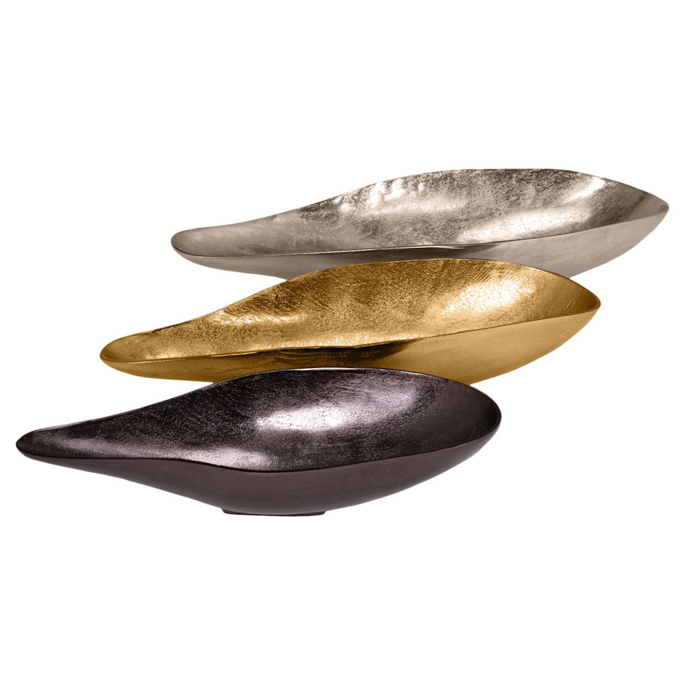 Set of three avocado-shaped metal decorative bowls in silver, gold, and charcoal grey, with a textured hammered finish.