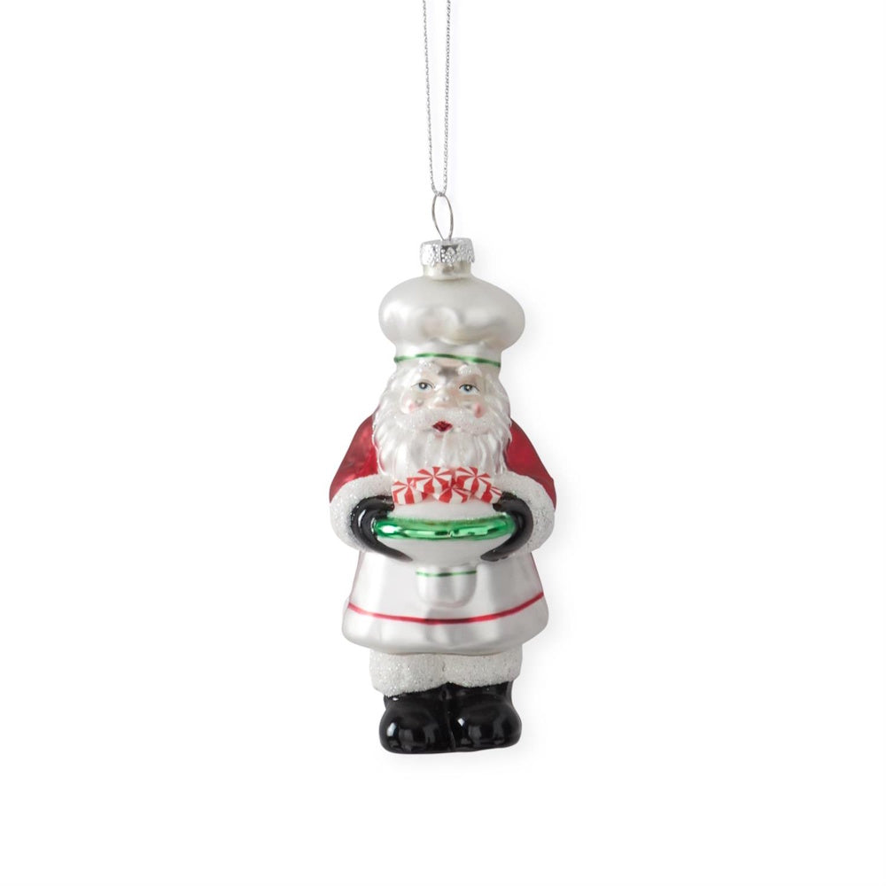 A hanging Chef Santa blown glass ornament holding candies.