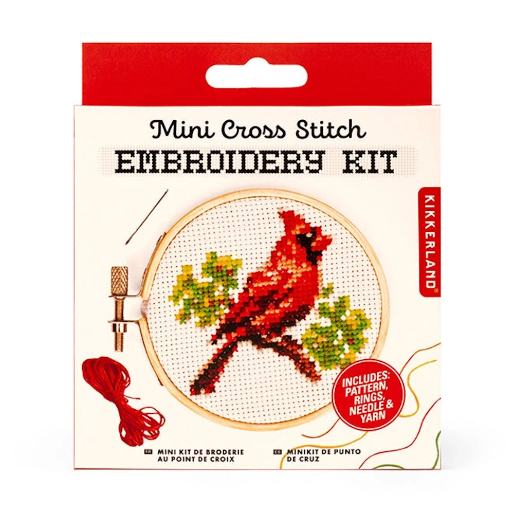 Kikkerland Mini Cross Stitch Embroidery Kit featuring a red cardinal bird pattern with hoop, needle, and red yarn.