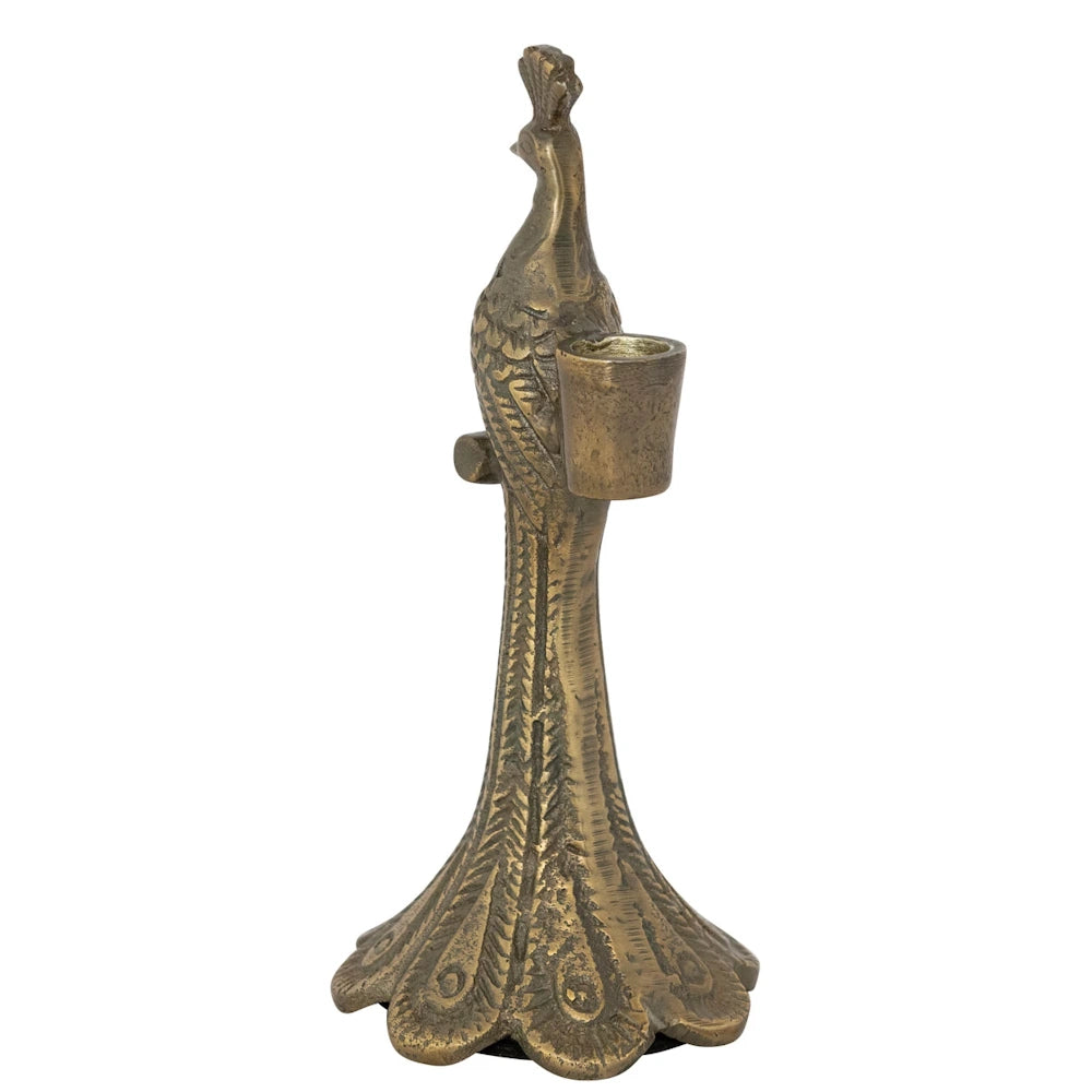 Vintage-style cast aluminum peacock-shaped taper candle holder with an antique bronze finish on a white background.