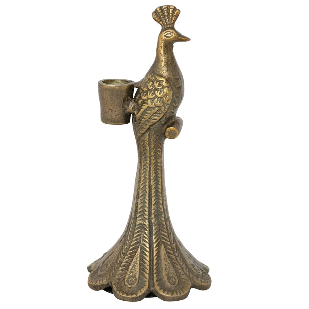 Antique brass-finish cast aluminum peacock taper candle holder with detailed feather texture on a white background.