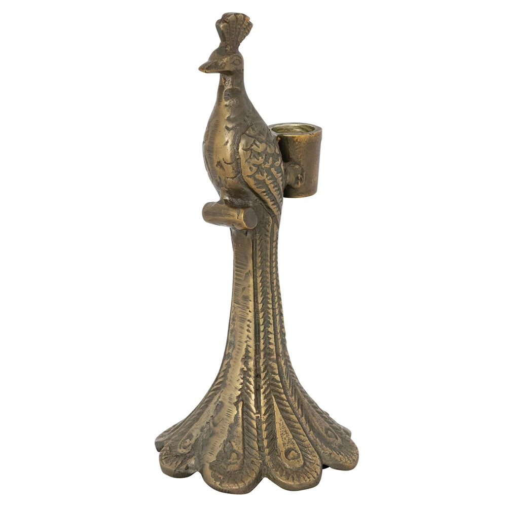 Antique brass peacock taper candle holder with detailed feather pedestal base and cast aluminum finish on white background.