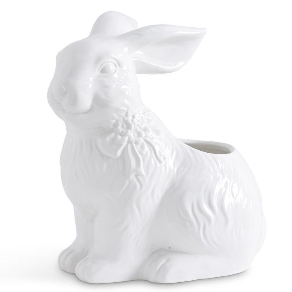 A glossy white ceramic bunny figurine with an open back designed to be used as a plant pot.