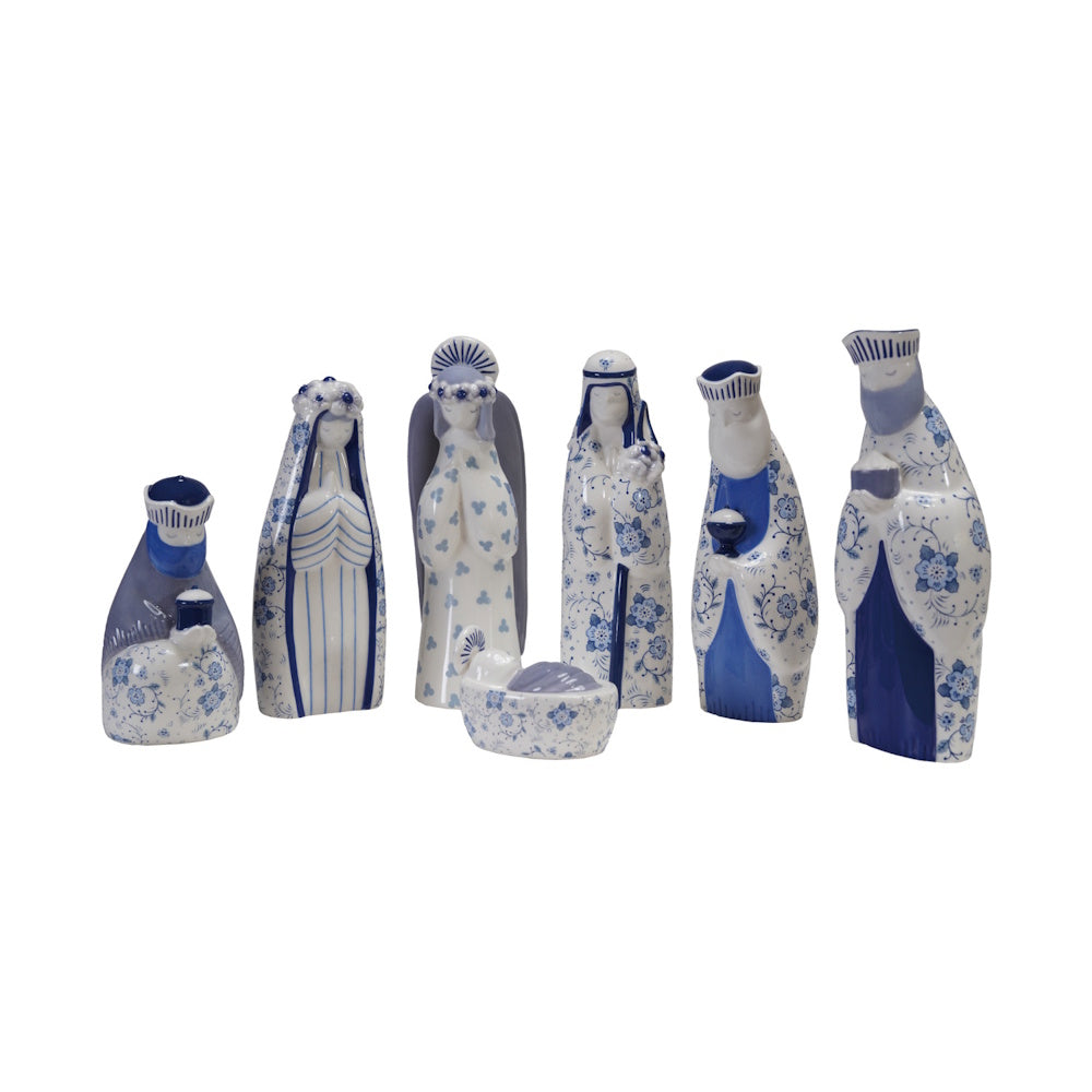 Blue and white ceramic nativity figurine set featuring floral patterns against a plain white background.
