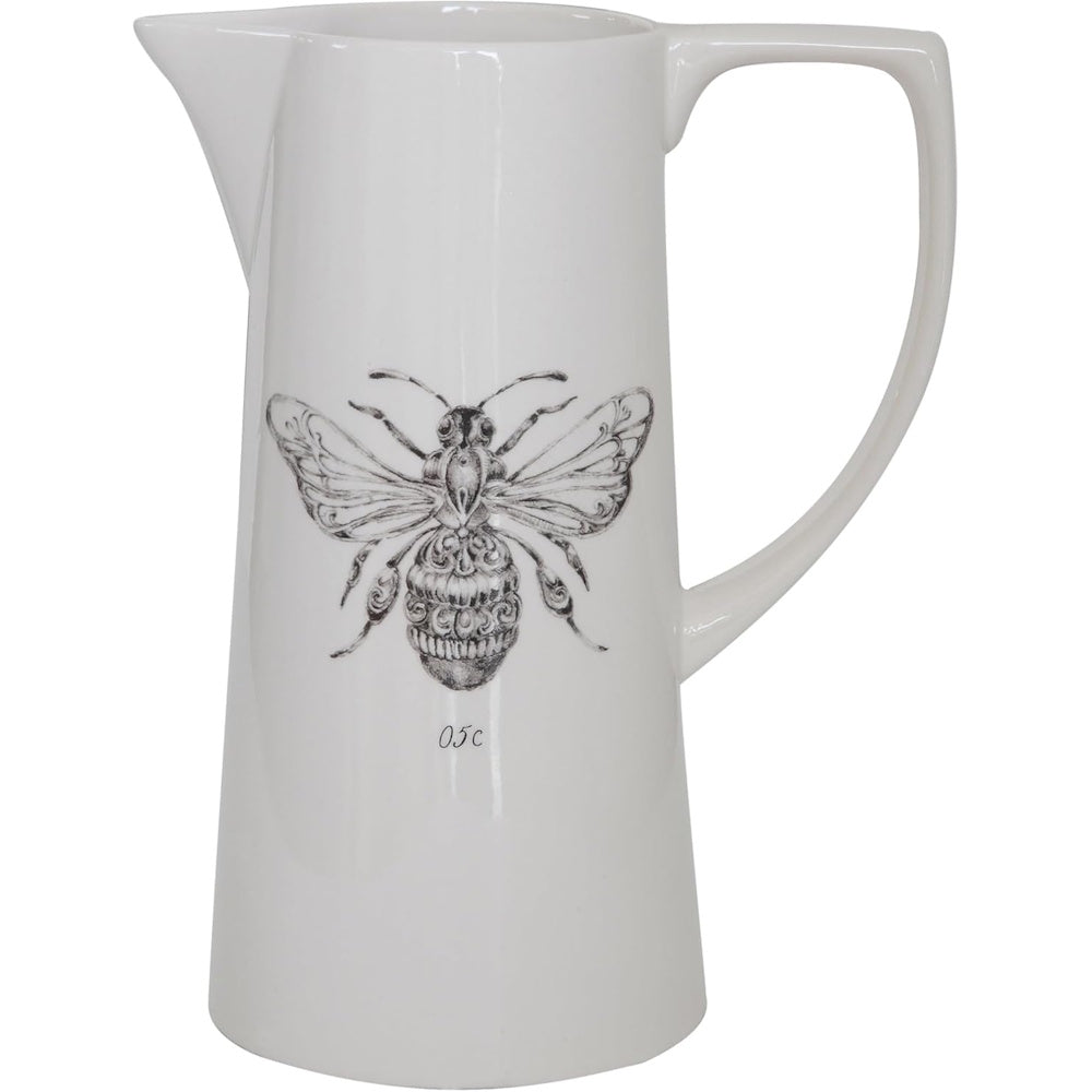White ceramic pitcher featuring a black detailed sketch of a bee on a plain background.