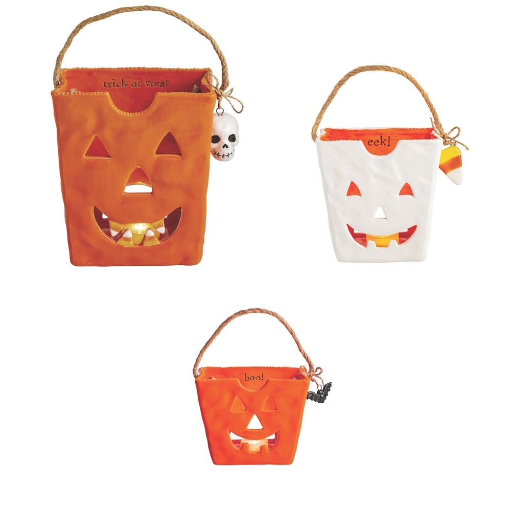 Ceramic trick-or-treat bag Halloween lanterns with jack-o'-lantern faces.