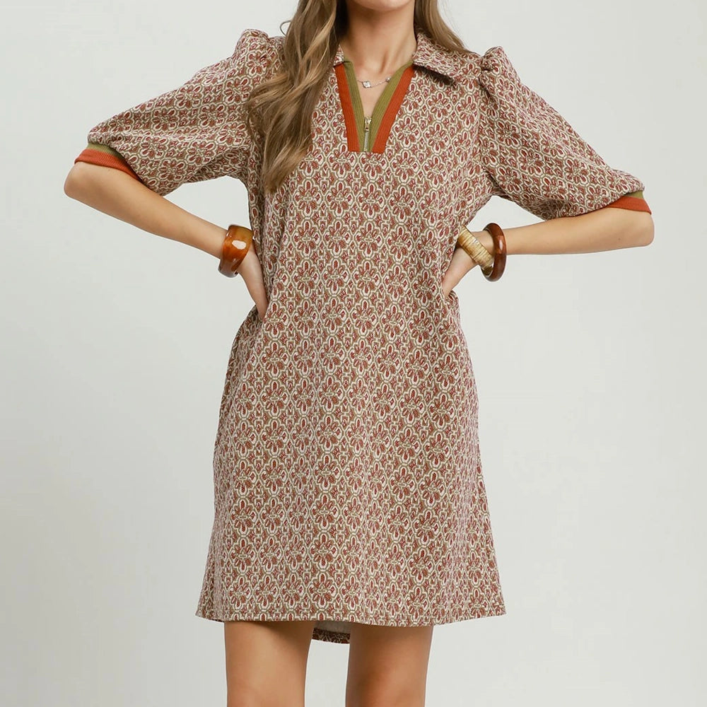 Chestnut geometric print shift dress with half-zip collared neckline and short puff sleeves.