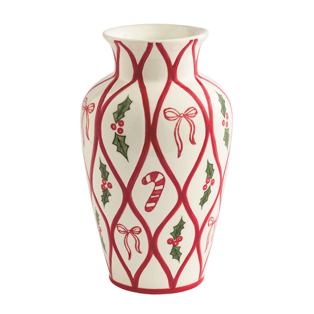 White ceramic vase with red lattice line pattern enclosing painted bows, candy canes, and holly.