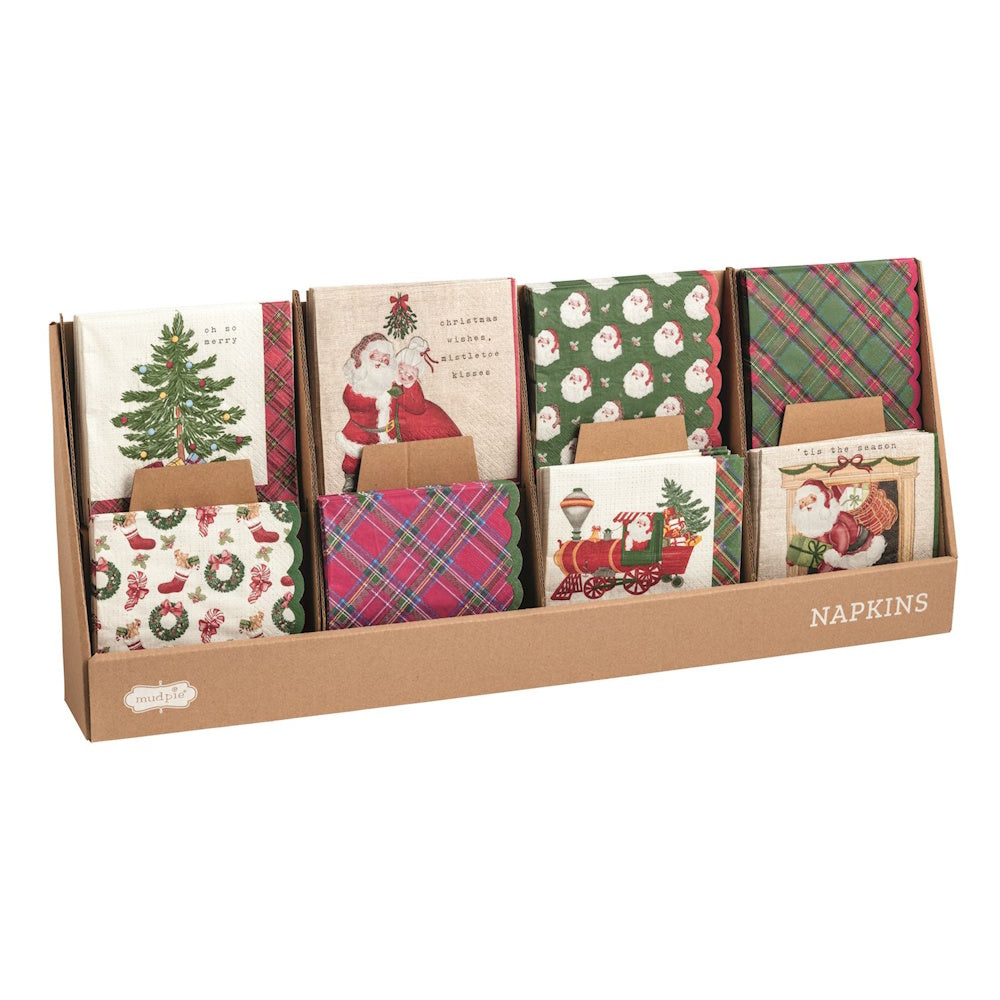Cardboard retail display box filled with assorted vintage Christmas cocktail paper napkin sets.