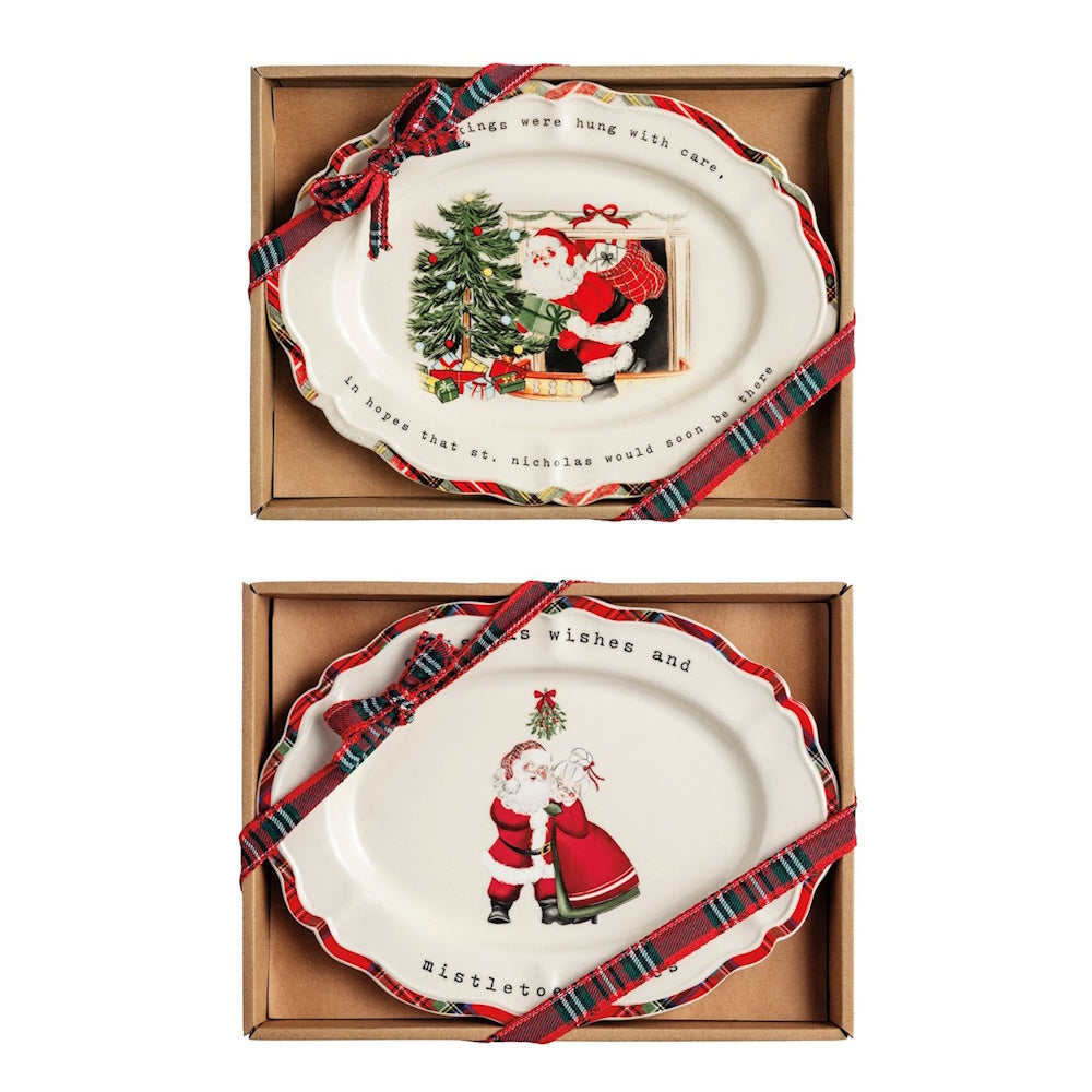 Set of two oval Christmas sentiment plates tied with plaid ribbons in gift boxes.