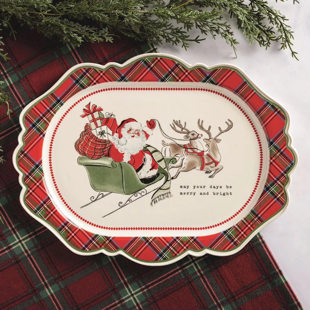 Vintage ceramic platter with a red plaid border, featuring Santa in his sleigh pulled by reindeer.