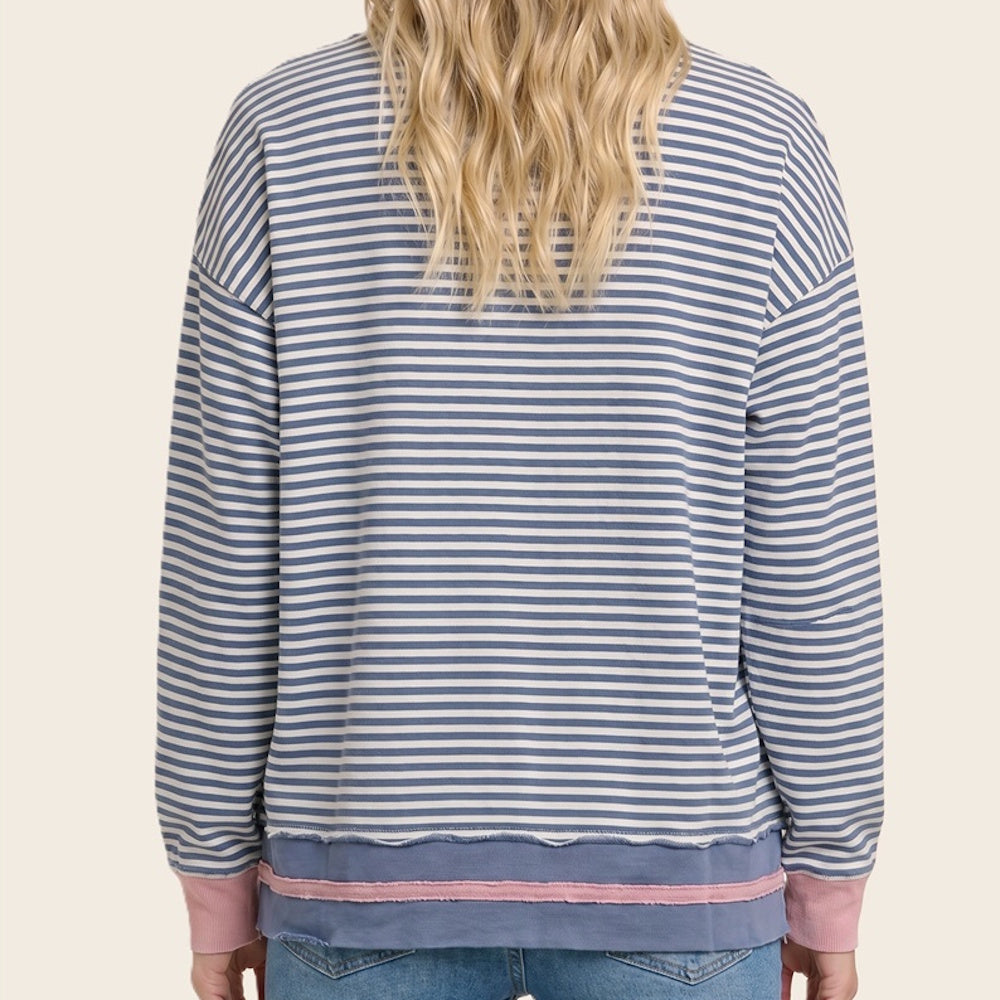 Back view of a blue and white striped cotton sweatshirt with pink contrast cuffs and hem.