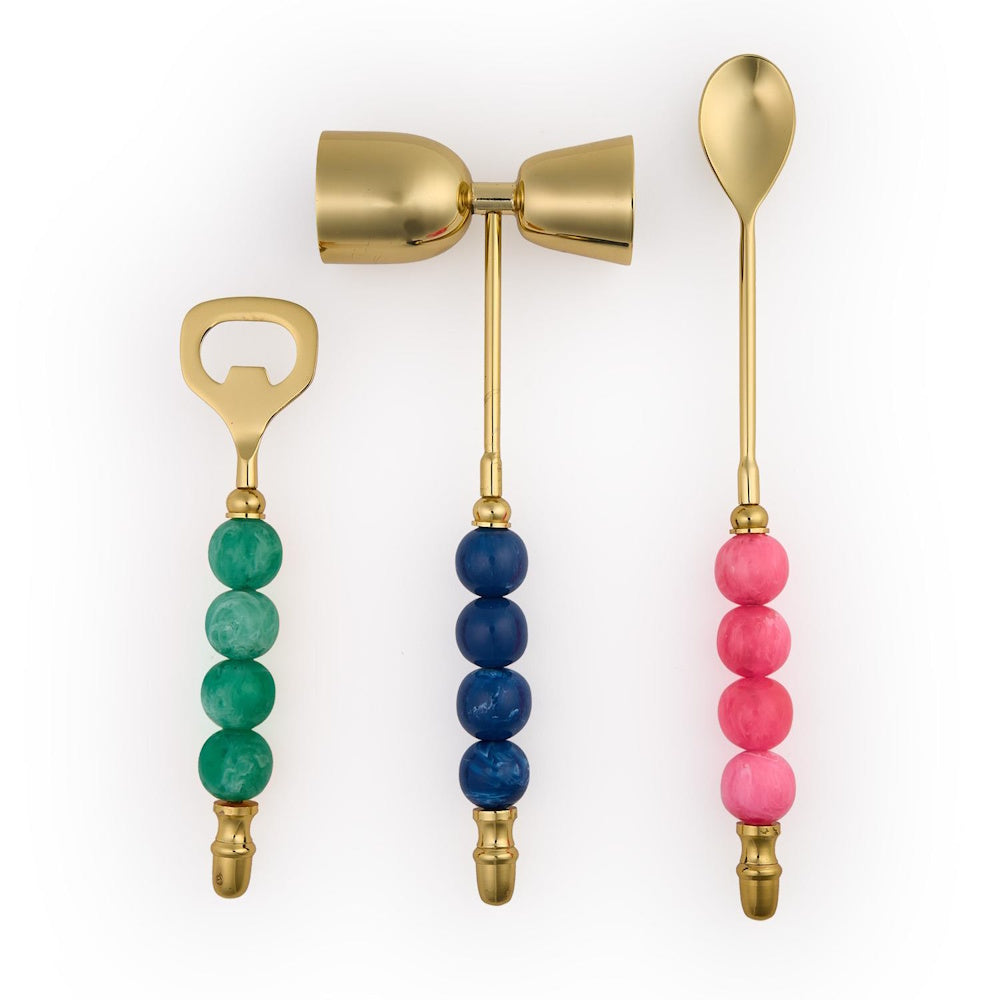 Three-piece gold cocktail bar set with colorful beaded handles on a white background.