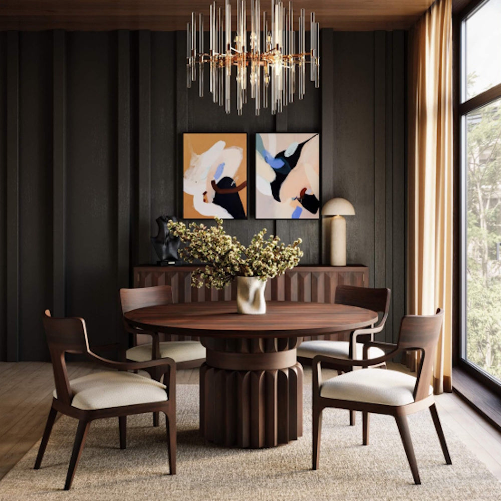 Colorado mid-century modern wooden dining chairs with cushions around a round walnut table.