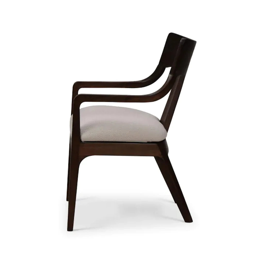 Side profile of Colorado dark wood dining armchair with cream cushion.