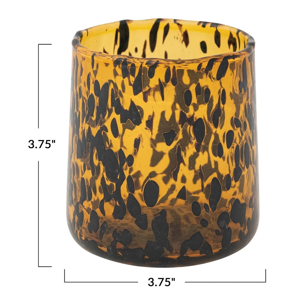 Amber and black tortoiseshell confetti drinking glass with dimensions 3.75 inches by 3.75 inches on a white background.