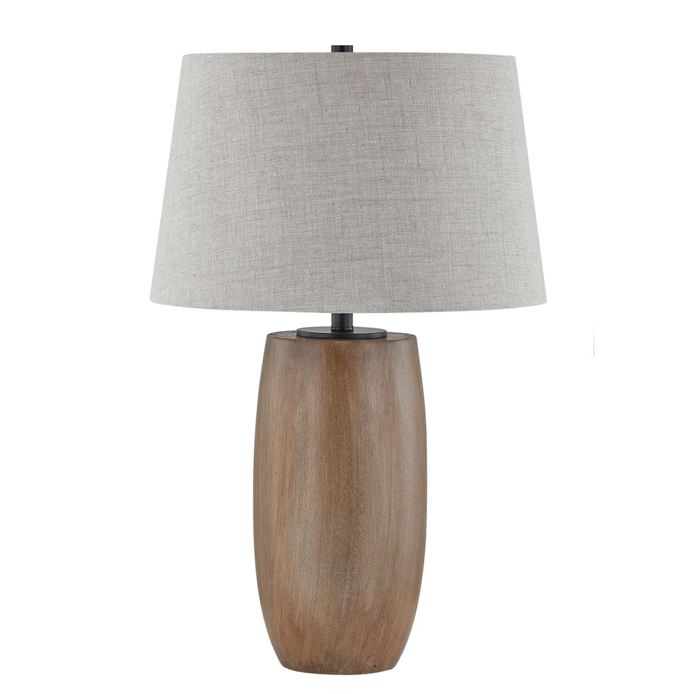 Natural wood table lamp with oval base, gray fabric drum shade and black metal accents.