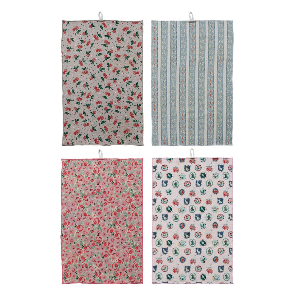 A set of four cotton printed terry cloth tea towels with diverse patterns.