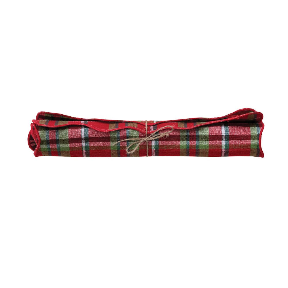 Rolled cotton tartan plaid table runner tied with twine.