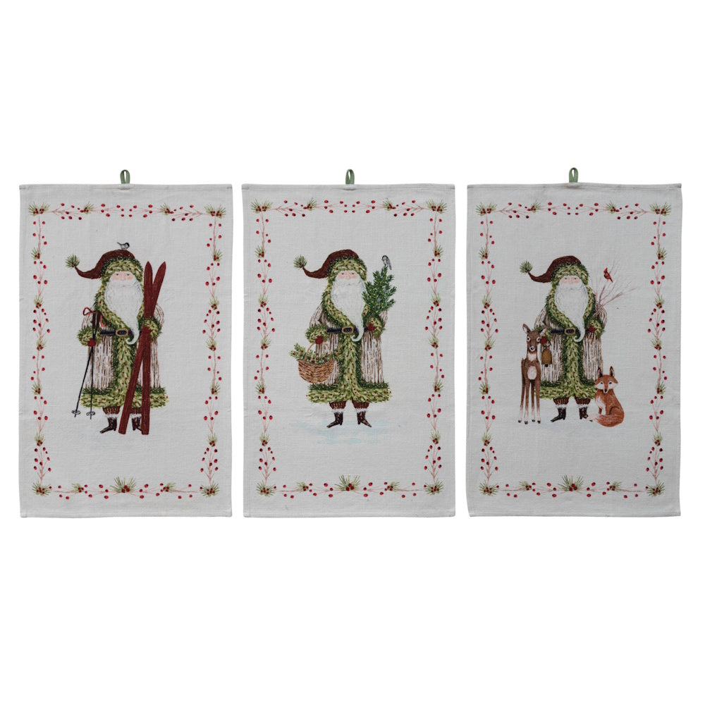 Set of three cotton slub printed Christmas tea towels featuring different festive Santa designs with berry borders.