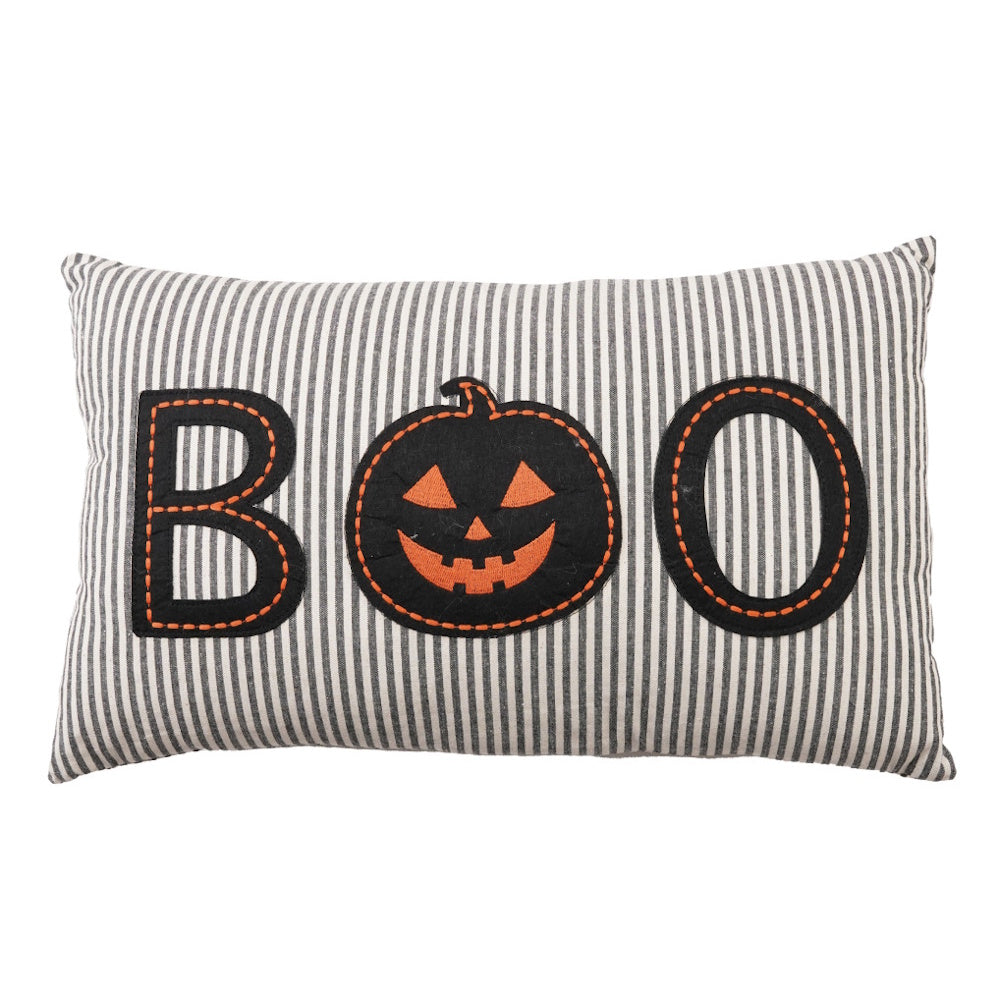 Striped lumbar pillow with a black appliquéd jack-o'-lantern spelling out "BOO".