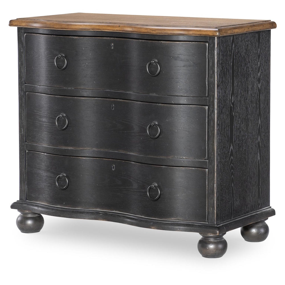 Black three drawer accent chest with curved drawer fronts, ring pulls, bun feet, and wood top.