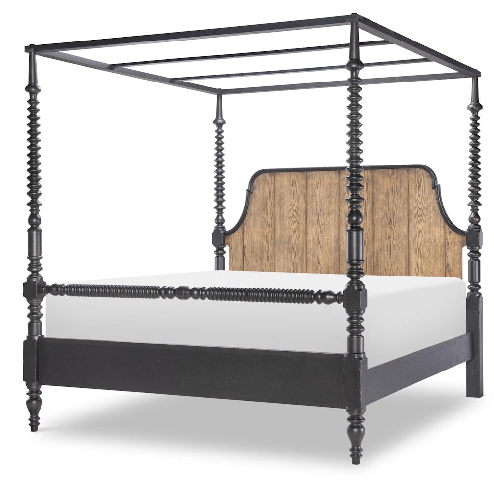 Black bobbin post canopy bed with a wood grain headboard and tall decorative turned posts.