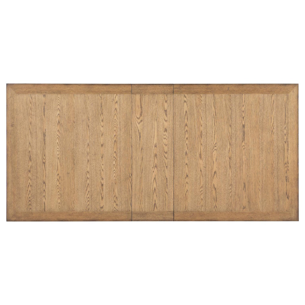 Top view of rectangular wood tabletop with natural oak finish, plank pattern, and framed border edge.