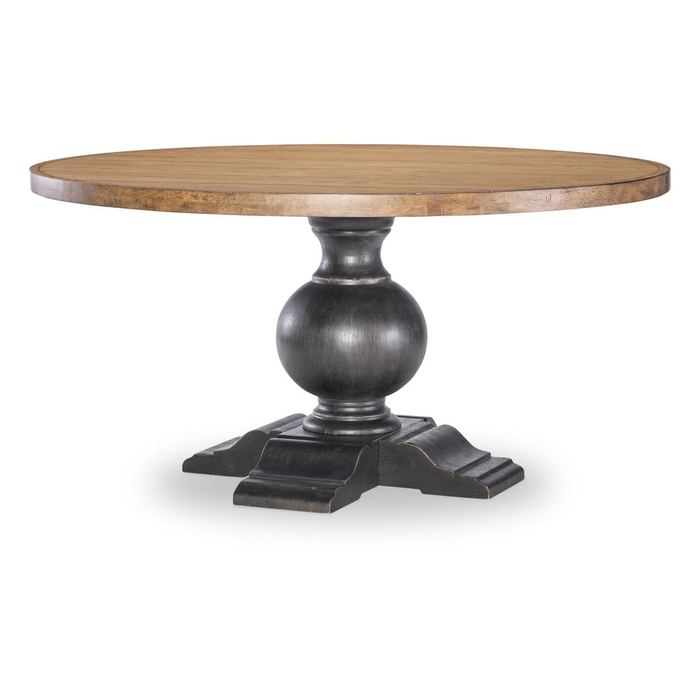A round wooden dining table with a light brown top and a dark, chunky pedestal base on a white background.