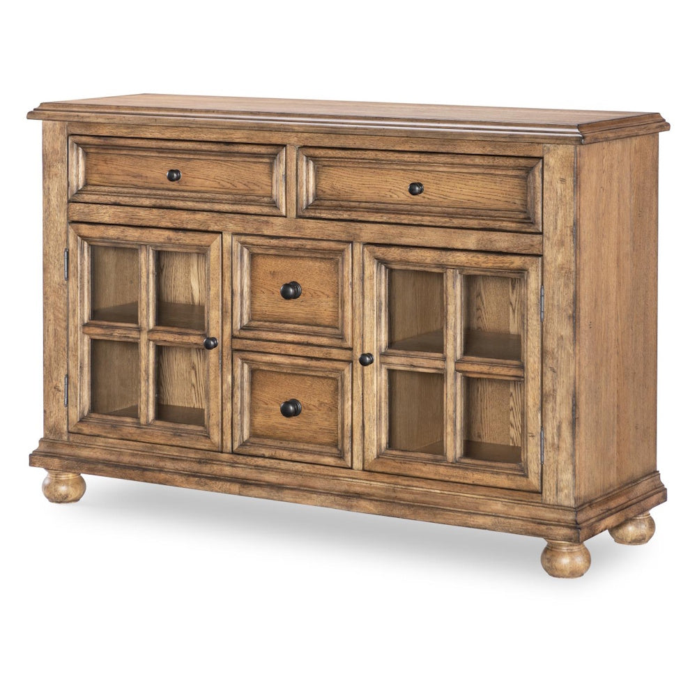 Rustic wooden buffet server with glass cabinet doors and drawers.