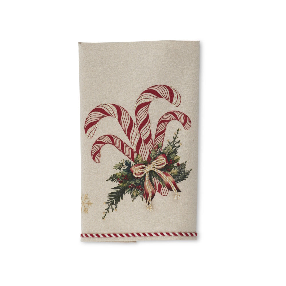 Cream holiday hand towel featuring red and white candy canes, pine sprigs, a red ribbon, and gold snowflakes.