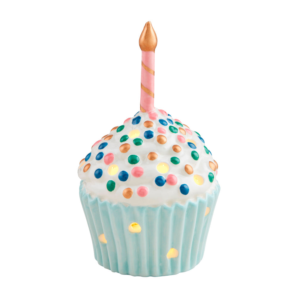 Light-up ceramic cupcake sitter with colorful sprinkles, pink birthday candle, and light-blue base on white background.
