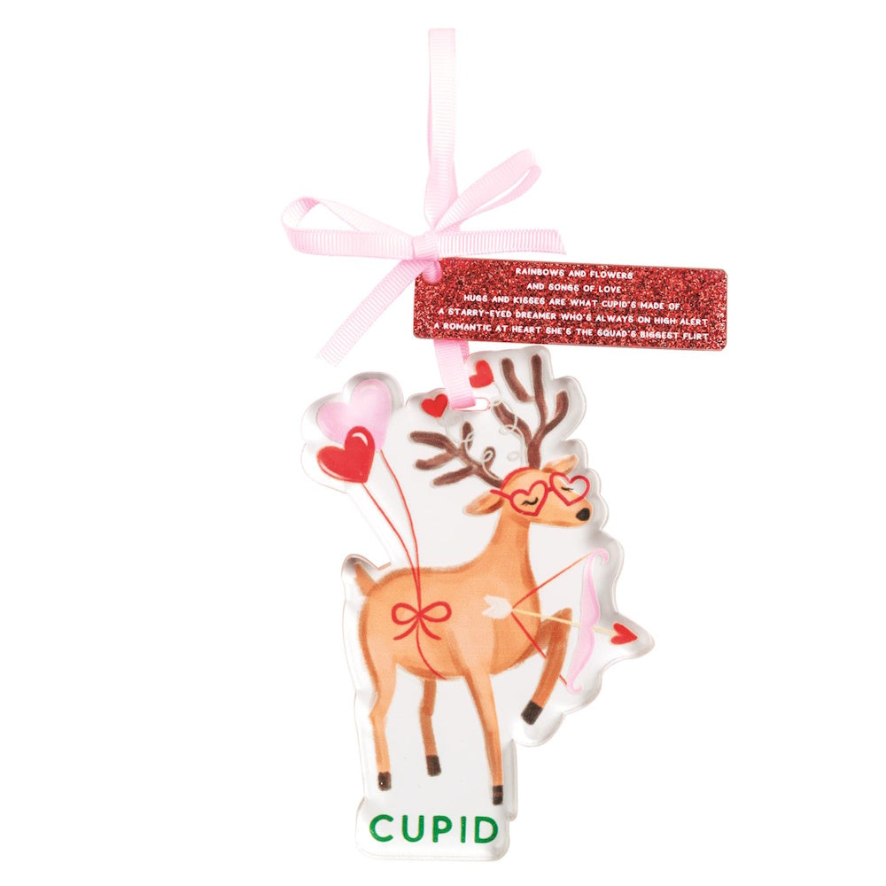 Cupid the reindeer Christmas ornament with heart glasses, bow and arrow, and a pink hanging ribbon.