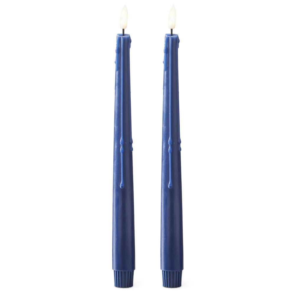 Pair of dark blue drip-effect LED taper candles with glowing faux flames against a white background.