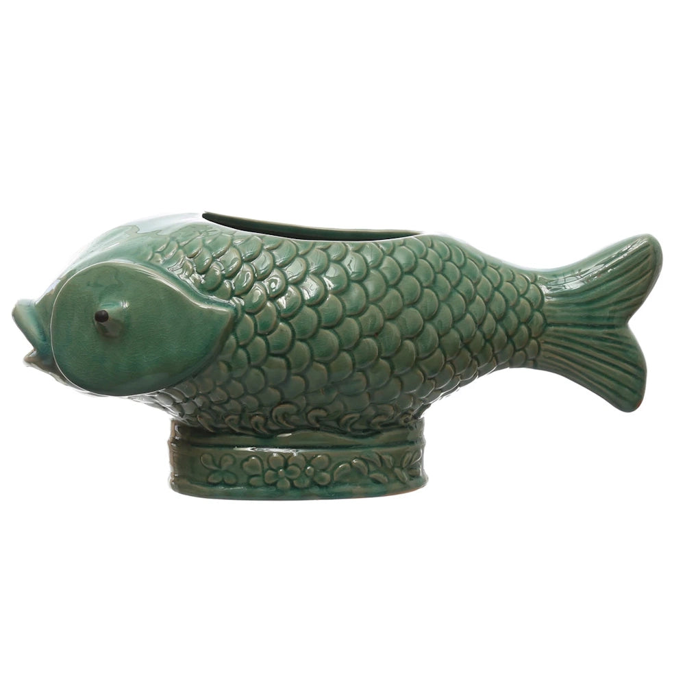Green debossed stoneware fish planter with a textured scale pattern and a decorative floral base on a white background.