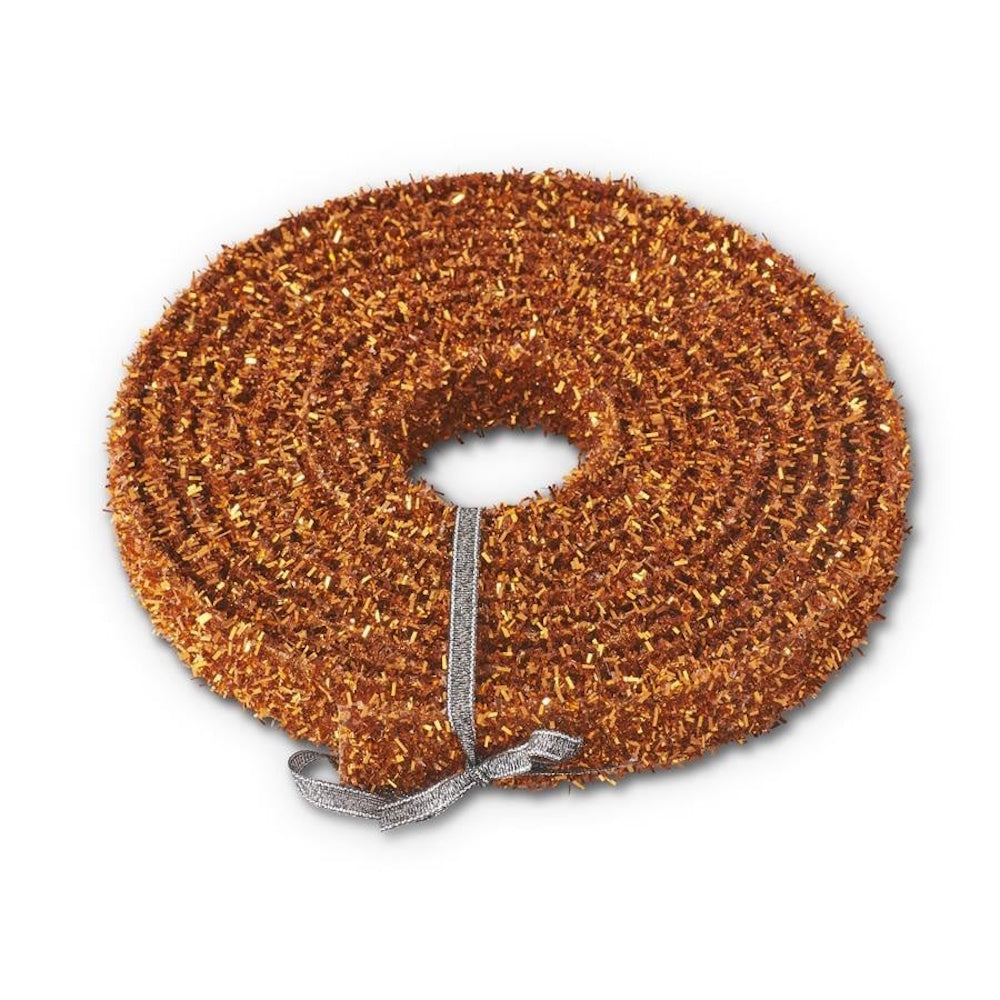 Coiled roll of sparkling orange tinsel ribbon tied with a thin silver ribbon on a white background.
