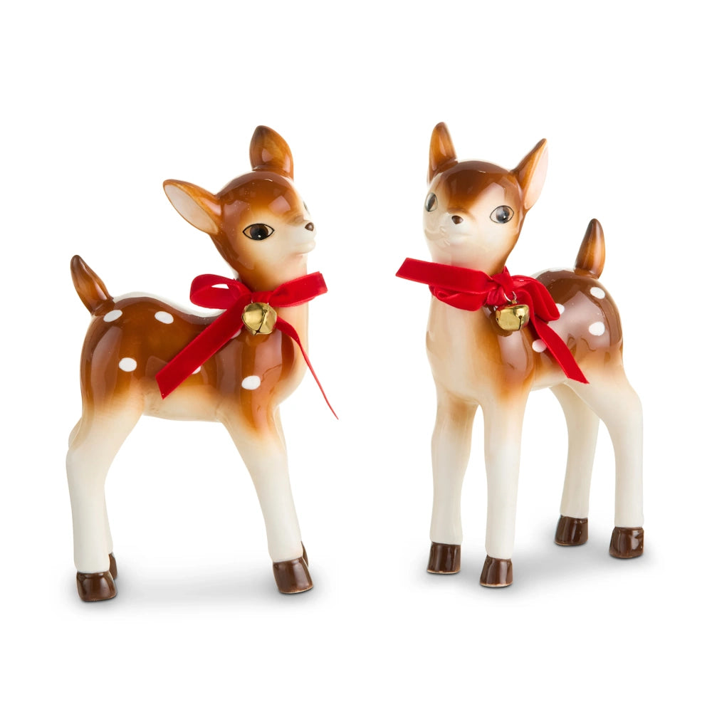 Two vintage-style ceramic deer figurines with white spots and red ribbons with small gold bells.