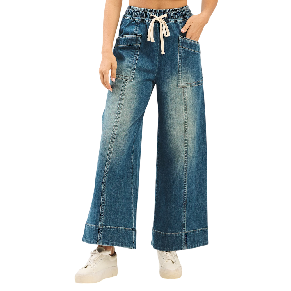 Faded wide-leg denim pants with elastic drawstring waist and front patch pockets.