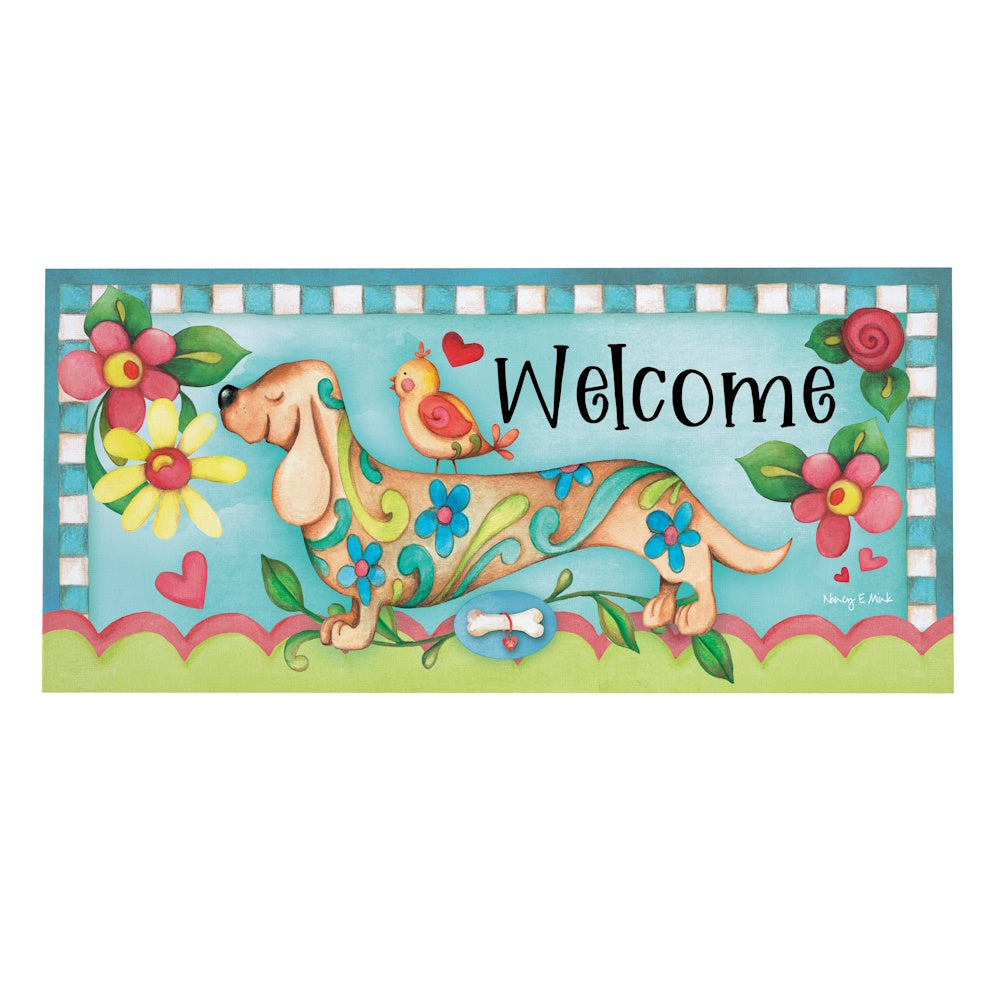 Colorful welcome mat featuring a floral-patterned dachshund, a bird, and flowers.