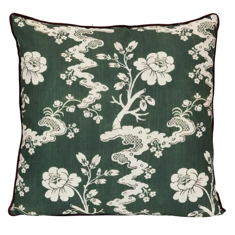 Dark green floral throw pillow with white botanical patterns and dark piping for elegant home decor.