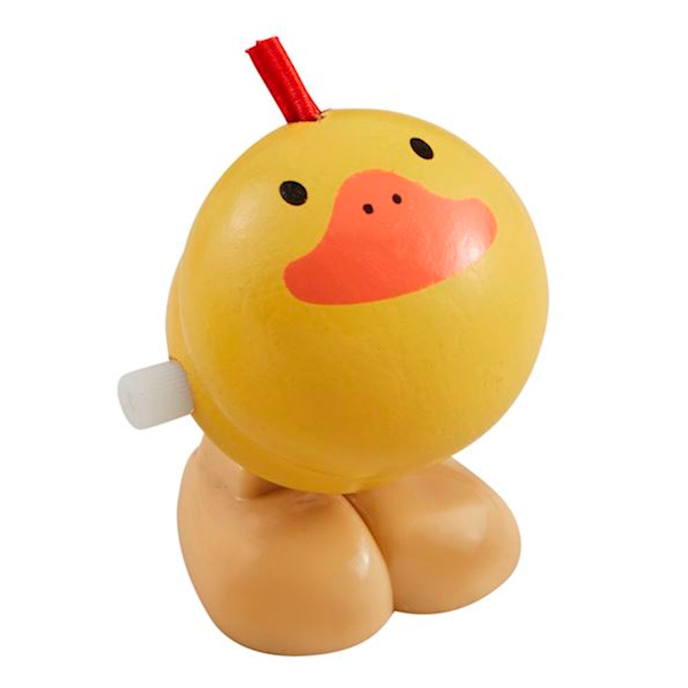 Yellow wooden wind-up duck toy with a red ribbon and white knob, isolated on white. Perfect for eco-friendly nursery decor.