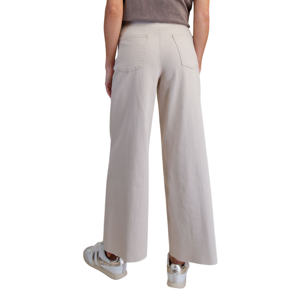 Back view of ecru high-waisted wide-leg twill pants with back patch pockets.