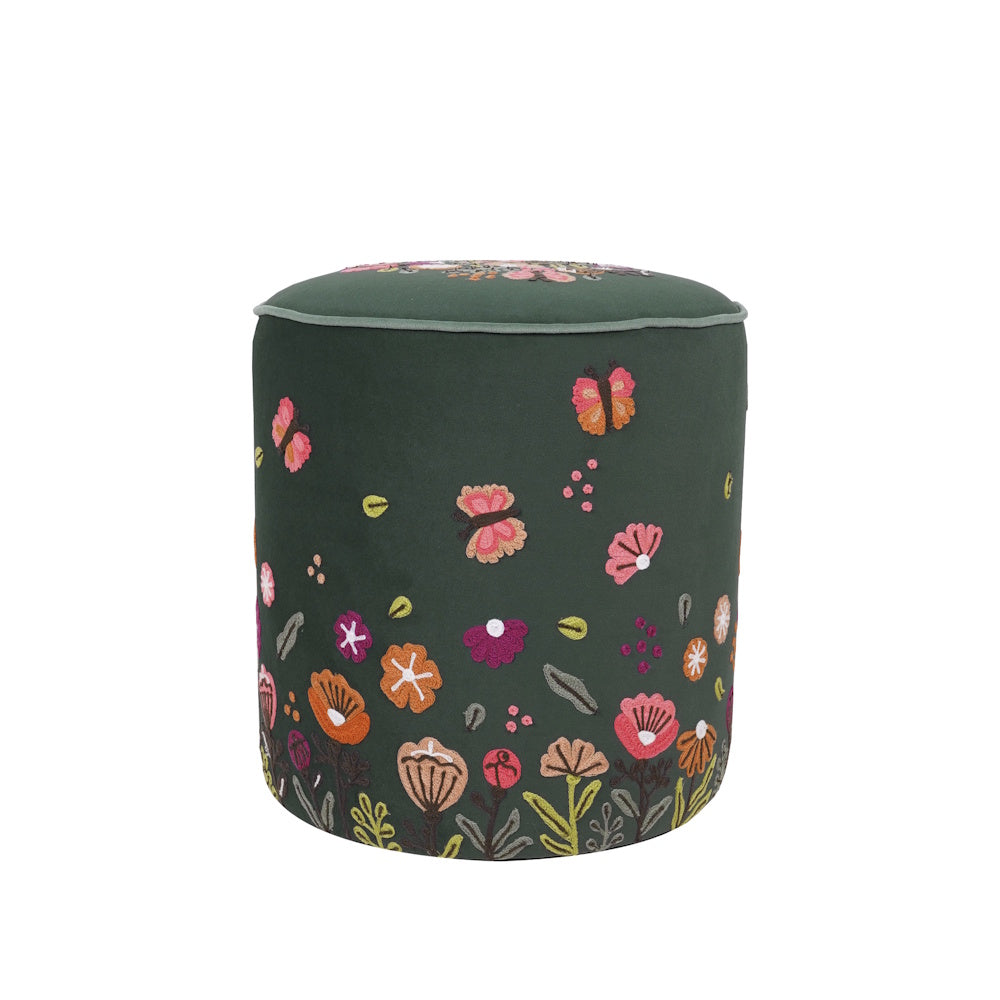 Green velvet round ottoman with embroidered floral and butterfly patterns for living room seating.