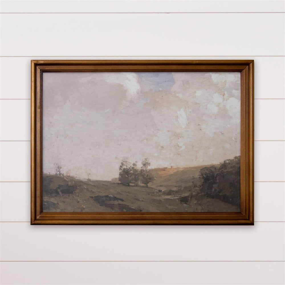 Vintage English landscape oil painting in a gold wood frame hanging on a white shiplap wall.