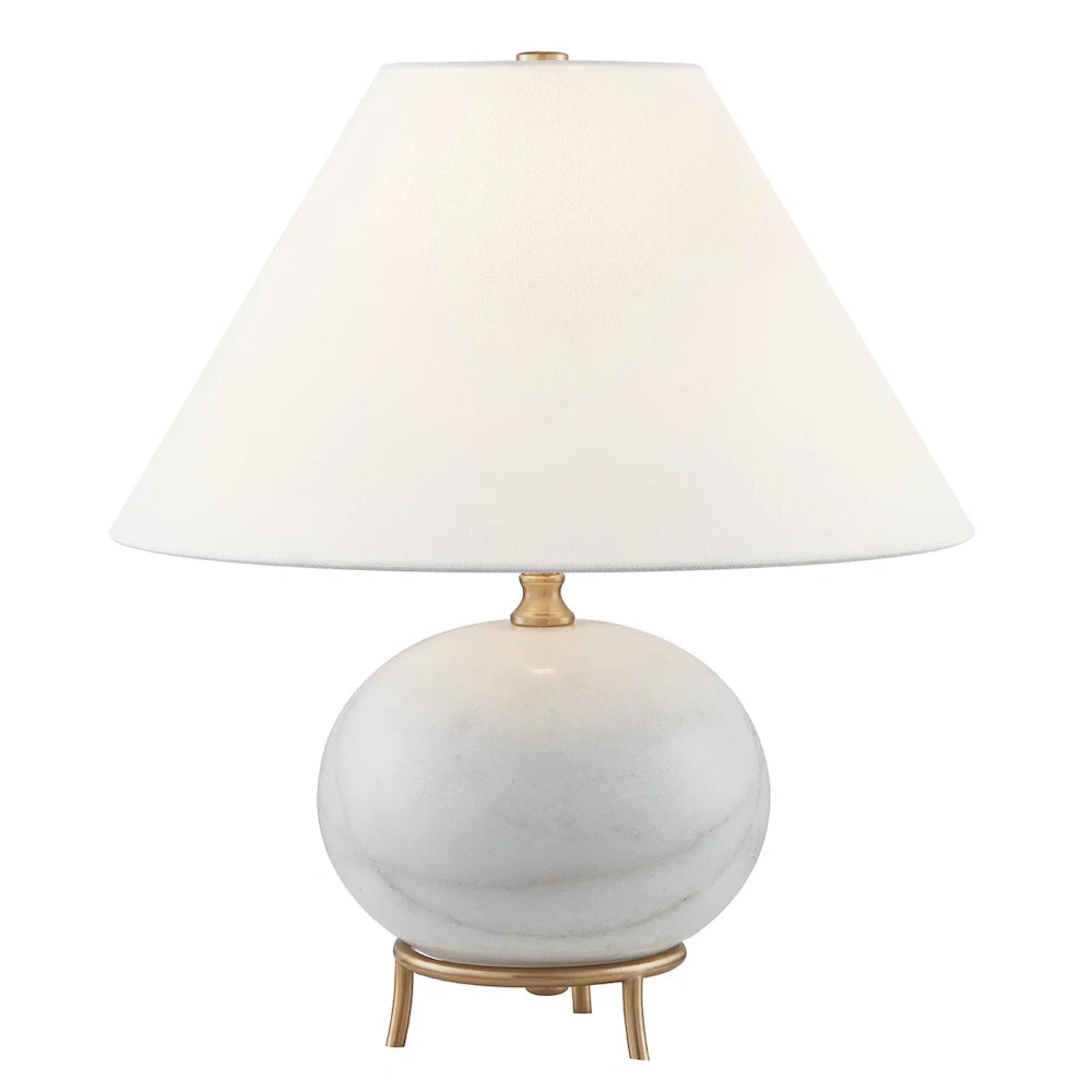 Modern marble table lamp with a white tapered fabric shade and gold tripod metal base for elegant home decor.