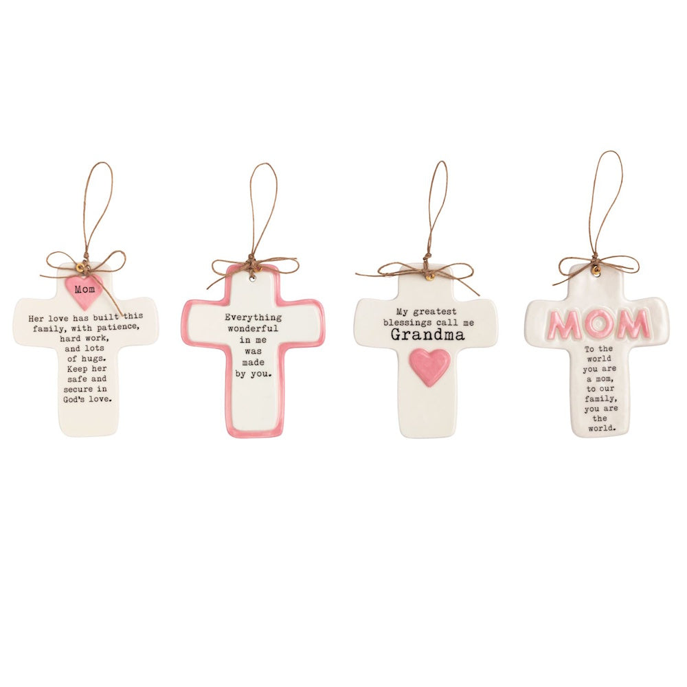 Four ceramic hanging crosses with pink accents and sentimental messages for Mom and Grandma on a white background.