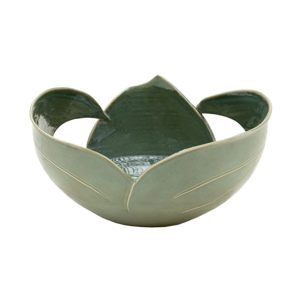 Green ceramic bowl shaped like a lotus flower with leaf-like petals forming handles.