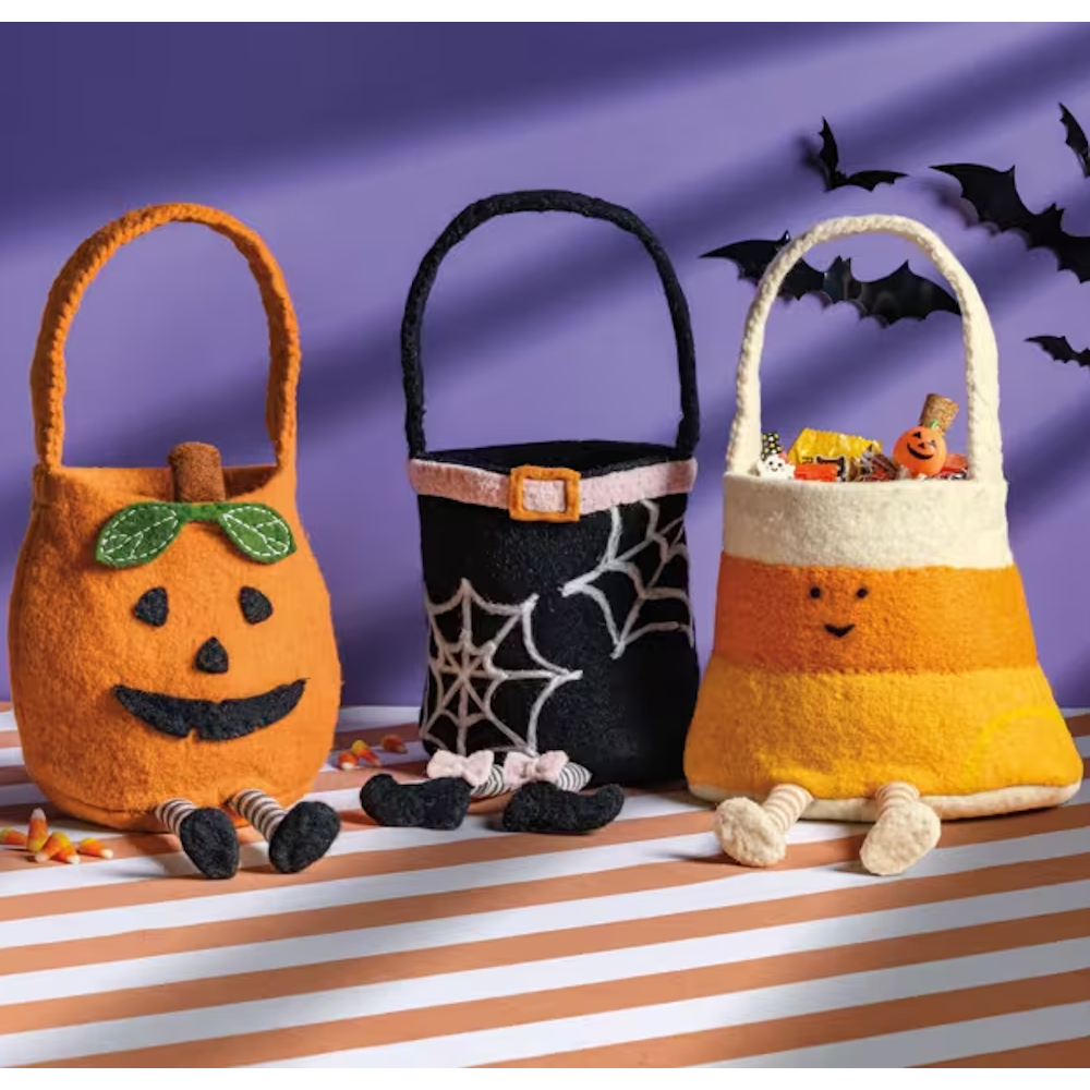 Set of three Halloween felt treat buckets shaped like a pumpkin, witch with spiderwebs, and candy corn, featuring dangling legs.