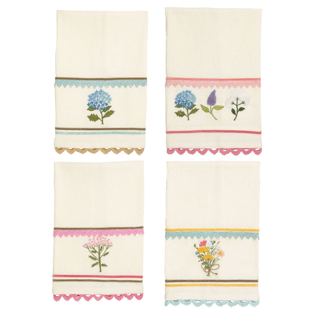 Four cream waffle-knit hand towels with embroidered floral designs, lace trim, and scalloped edges in various colors.