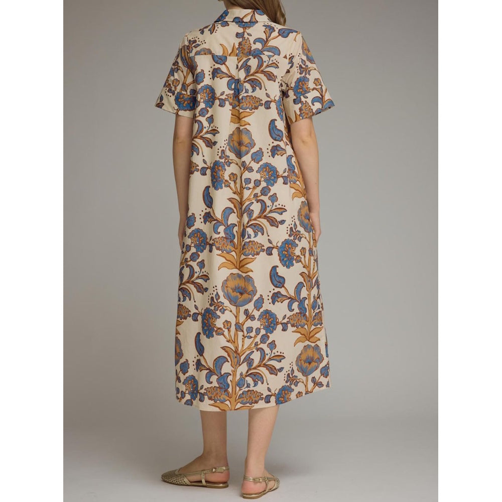 Back view of beige floral midi shirt dress with blue and brown patterns, collared neckline, and short sleeves.